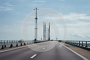 Experience the Modern Oresund Bridge with a Clear Sky and Serene Sea View. photo