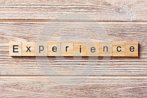 Experience word written on wood block. experience text on table, concept