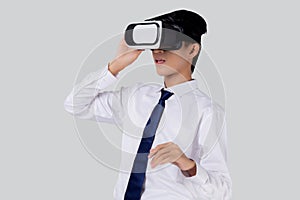 Experience of young asian businessman wearing VR Headset with excited isolated on white background.