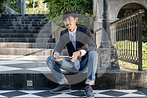 Experienced businessman. picture of a businessman. Asian businessmen sit in front of modern office buildings