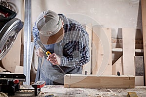 Experienced carpenter work with wooden