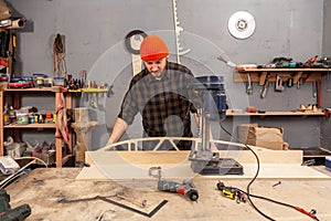Experienced carpenter work in workshop