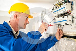 Experienced electrician doing electrical work