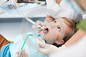 Experienced female dental doctor is treating