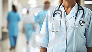 Experienced female doctor wearing stethoscope in hospital, blurred interior background photo