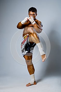 An experienced fighter kickboxer kick.