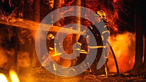 Experienced Firefighter Extinguishing a Wildland Fire Deep in a Forest. Professional in Safety