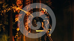 Experienced Firefighter Extinguishing a Wildland Fire Deep in a Smoke-Filled Forest. Professional in