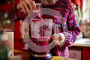Experienced home chef preparing smoothie tasty healthy beneficial drink dietary sustainable blender mixer crushing