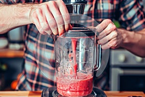 Experienced home chef preparing smoothie tasty healthy beneficial drink dietary sustainable blender mixer crushing