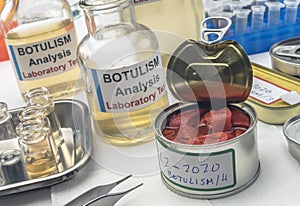Experienced laboratory scientist analyzes red peppers from a canned food can to analyze botulism infection in sick people,