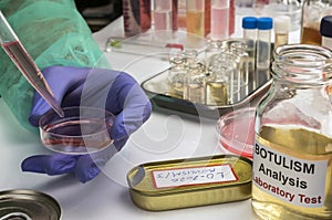 Experienced laboratory scientist analyzing a sample from a canned food can, botulism infection in sick people