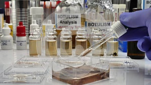 Experienced laboratory scientist analyzing a sample from a canned food can, botulism infection in sick people