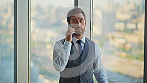 Experienced manager speaking mobile phone. Finance man boss negotiating on call