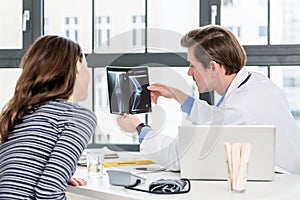 Experienced orthopedist discussing results with patient