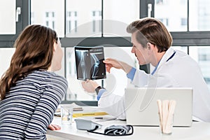 Experienced orthopedist discussing results with patient photo