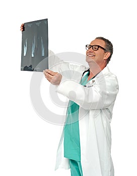 Experienced surgeon looking at x-ray report