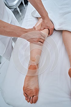 Experienced therapist performing a deep tissue massage