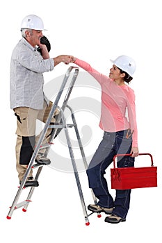 Experienced tradesman meeting his apprentice