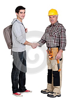 Experienced tradesman meeting new apprentice