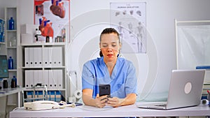 Experienced woman nurse giving online medical consultation