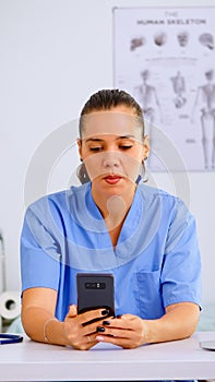 Experienced woman nurse giving online medical consultation