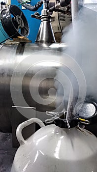 Experiment preparation in the cryogenics laboratory, filling up liquid nitrogen container