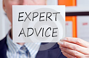 Expert Advice - Businesswoman holding sign with text