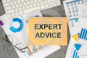 EXPERT ADVICE is written in a document on the office desk