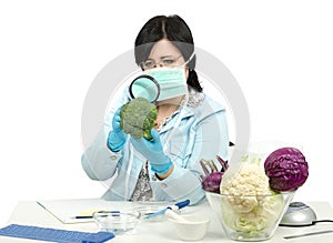 Expert carefully inspecting a broccoli in laboratory