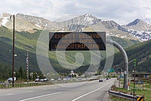 Expect  Delays Highway Sign on Interstate 70 in the Rocky Mountains of Colorado photo