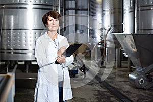 Expert examines equipment at winery