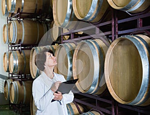Expert examines equipment at winery