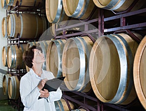Expert examines equipment at winery