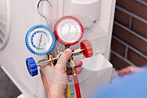 Expert Heat Pump Technician Repairing Air Conditioning