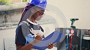 Expert inspecting refrigerant levels