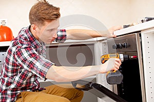 Expert panel fixing the kitchen oven