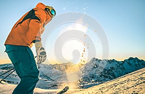 Expert professional skier at sunset on relax moment in french alps mountain slope