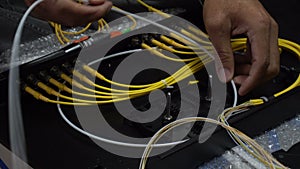 Expert technicians are connecting fiber optic cables