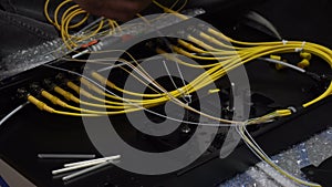 Expert technicians are connecting fiber optic cables