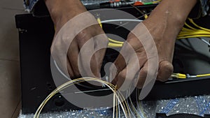 Expert technicians are connecting fiber optic cables