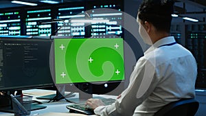 Expert updating server room systems using green screen computer