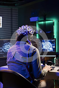 IT expert using neuroscience and EEG headset to gain digital soul photo