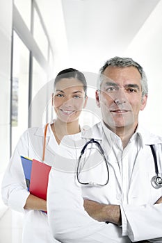 Expertise gray hair doctor beautiful nurse photo