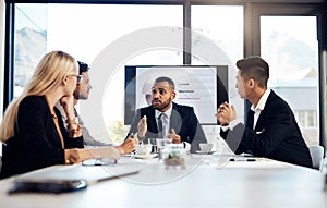 The experts in business expansion. a group of young businesspeople having a meeting in the boardroom of a modern office.