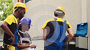 Experts replacing old condenser