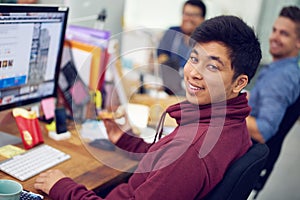 The IT experts. Shot of employees in an IT office.