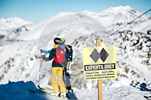 A experts only sign indicating a double black diamond run on the top of Blackcomb mountain.