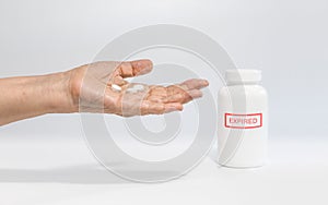 Expired drug on elderly hand