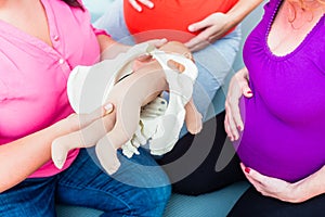 Explaining birth process with anatomic model of pelvic bones